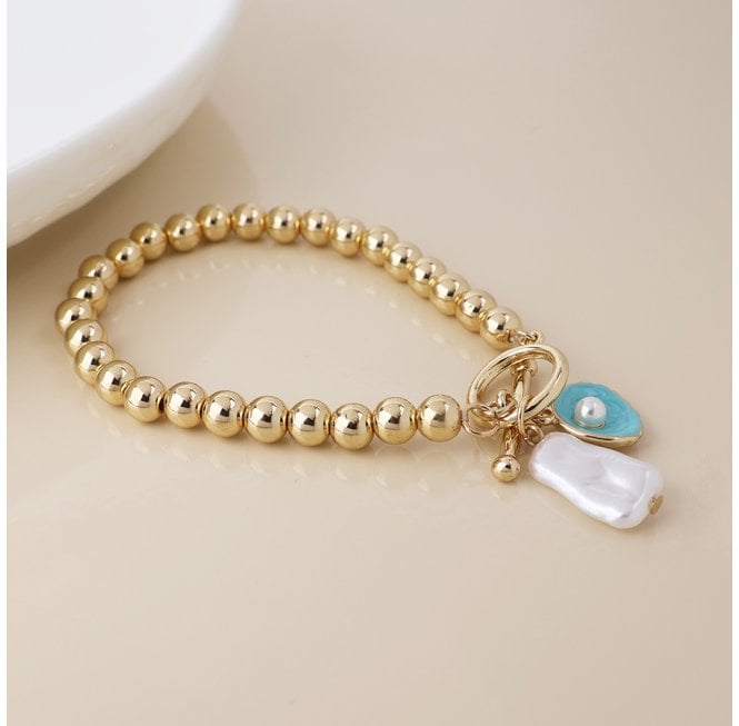 POM FAUX GOLD T BAR BRACELET WITH SHELL PEARL BEAD AND OYSTER CHARM
