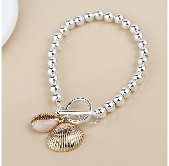 POM SILVER PLATED BEADED T BAR BRACELET WITH FAUX GOLD CONCH AND CLAM SHELL CHARMS