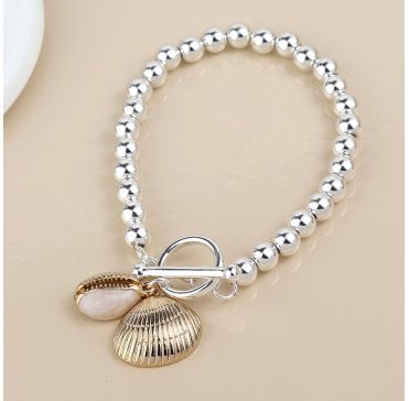 SILVER PLATED BEADED T BAR BRACELET WITH FAUX GOLD CONCH AND CLAM SHELL CHARMS
